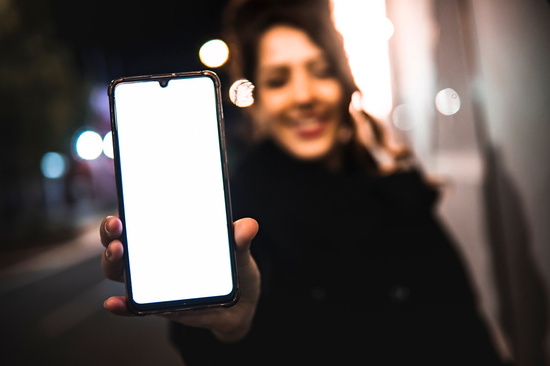 Caucasian girl showing phone