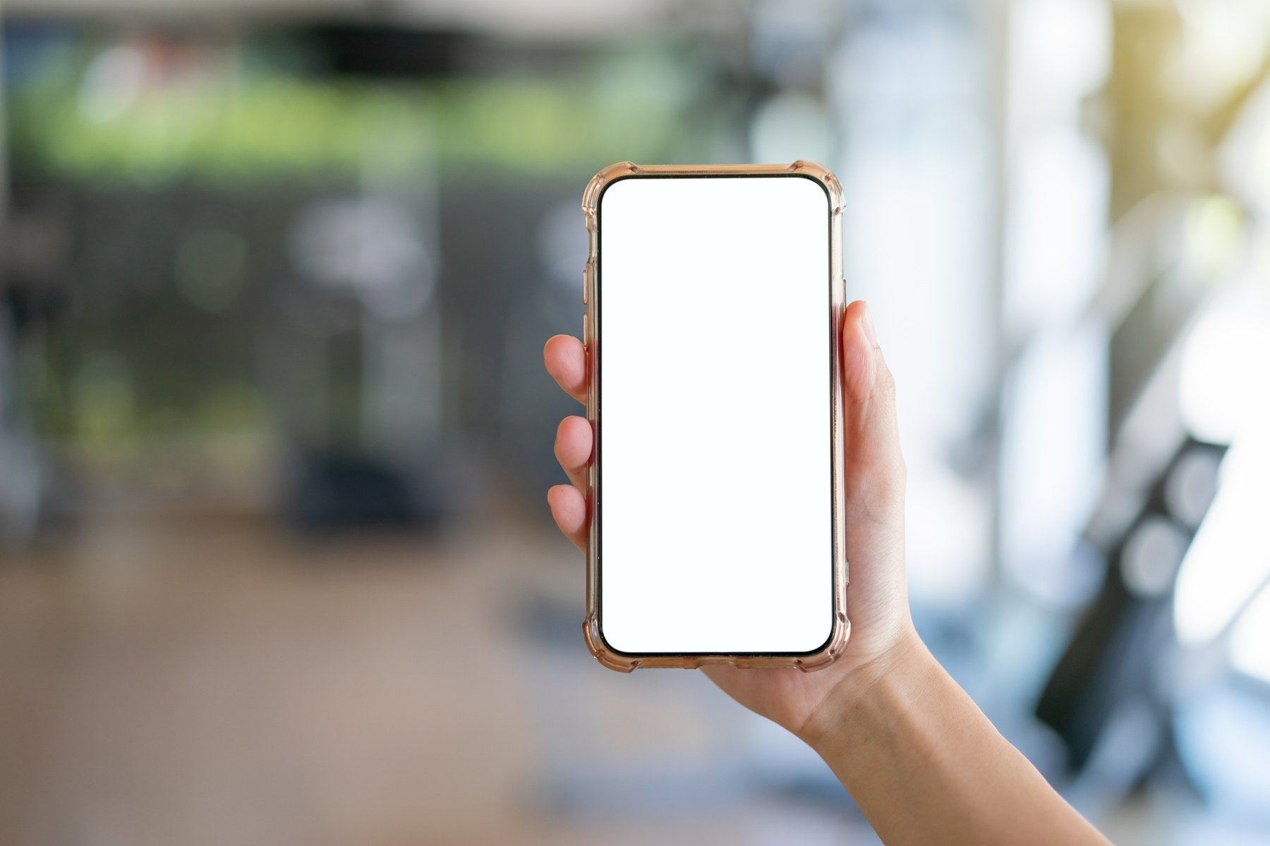 Hand Holding Mobile Phone with Blank White Screen Mockup